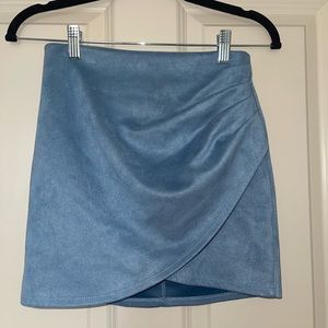 Mildly worn blue suede mini skirt in a size small. Tag was mistakenly removed